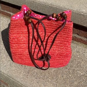 Pink rattan purse.